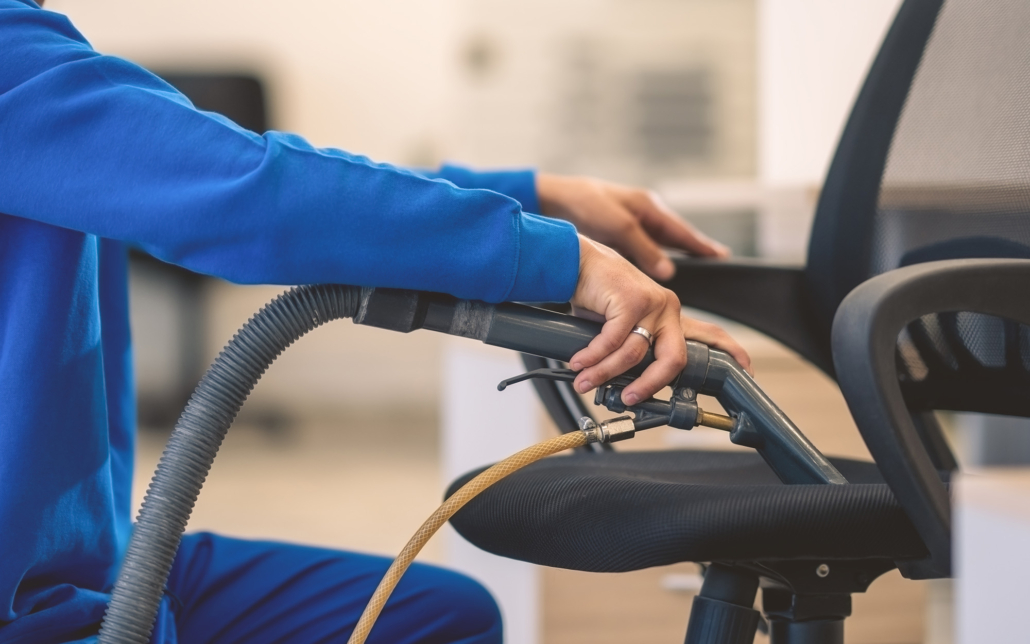 Close up view of commercial deep cleaning a chair